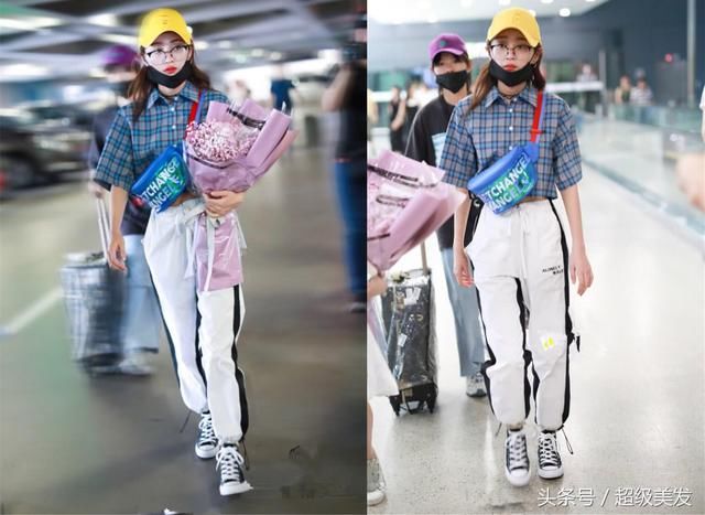 黄婷婷穿T恤裙现机场，居然在腰套了条牛仔短裤，网友：彻底服了