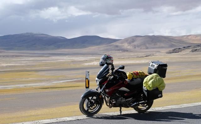 环游中国需要多少钱？开摩托车环游中国的小情侣来回答你