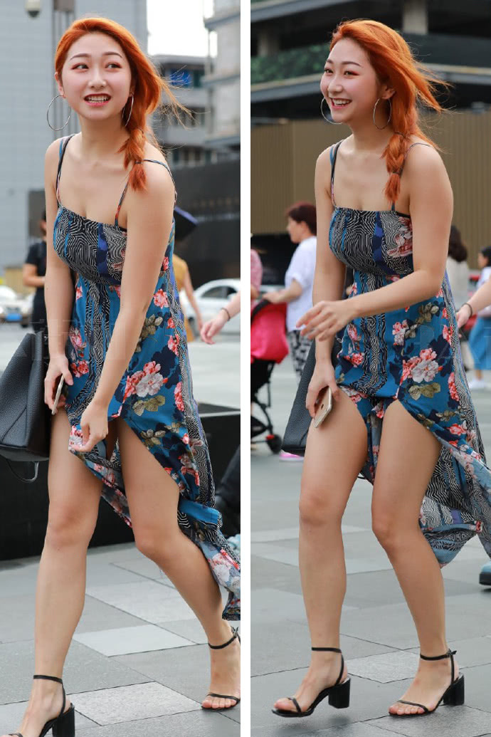 美女身穿吊带开叉连衣裙，一阵微风吹过扬起裙摆，真的是太美了