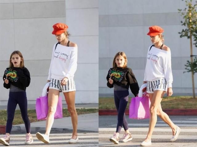 维密天使AA一袭斜肩裹身裙亮相，竟将如此老气卷发演绎出风情万种