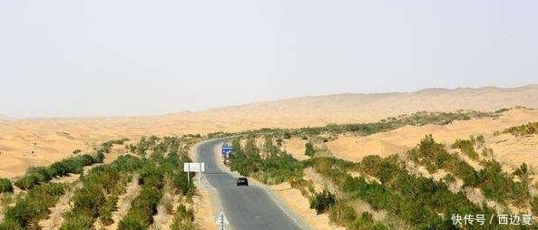  们国家：中国沙漠里的一条公路，每四公里有一口水井