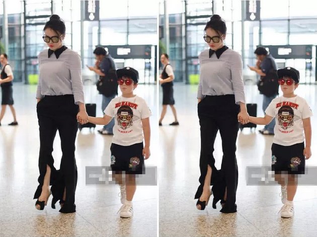 34岁冉莹颖用力过猛!衬衣喇叭裤凹造型真时髦，网友:裤脚怎么了