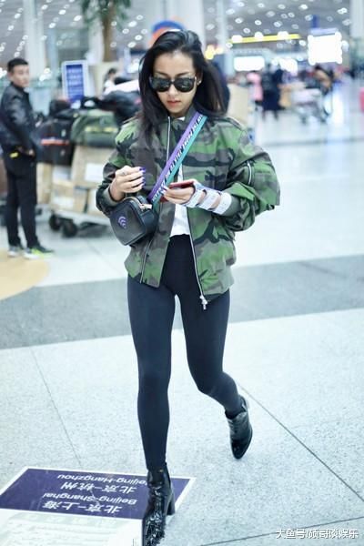吉克隽逸现机场，一条打底裤惹争议，网友目光全被她的大粗腿锁定