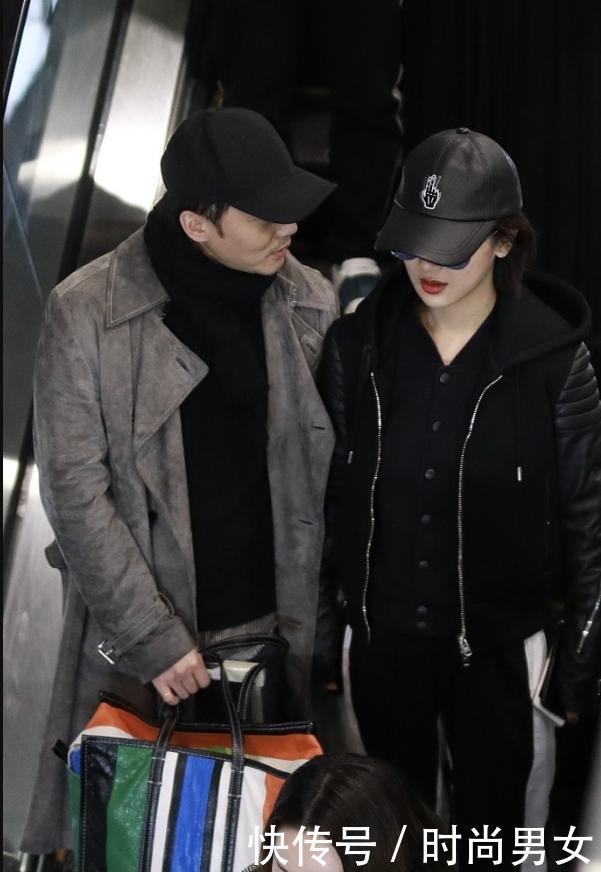 杨紫一身黑现机场，与身旁帅哥亲密耳语，网友：秦俊杰知道吗？