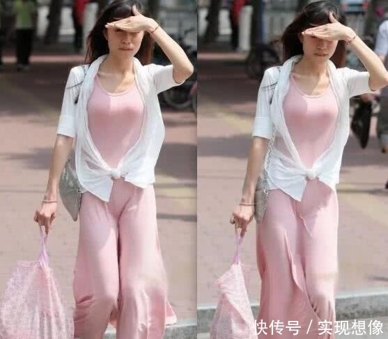  【粉色】摄影长腿美女身穿粉色长裙，风这么大还穿裙子逛街