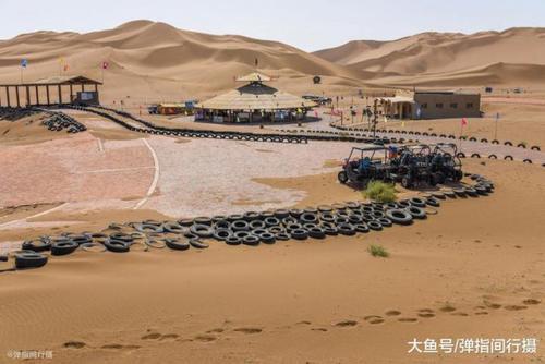 紧连城市的新疆库木塔格沙漠 堪称世界治沙“绿不退 沙不进”的奇