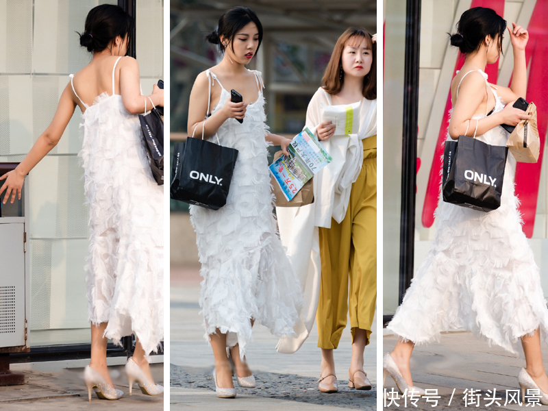 身穿白色吊带连衣裙的小姐姐，时尚优雅，而且还很有素质！