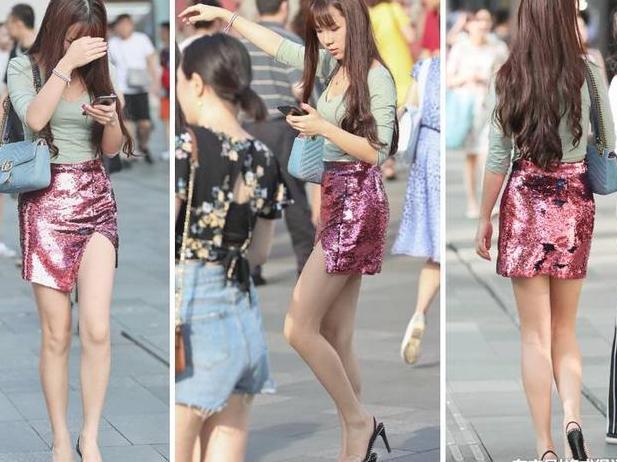 美女穿的裙子真窄，以至于开了一个小口，又恰到好处露出大长腿！