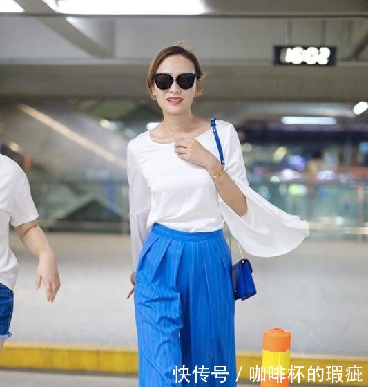 叶一茜现身机场,一条蓝色高腰裤穿得如此显瘦,这才是真正的细腰