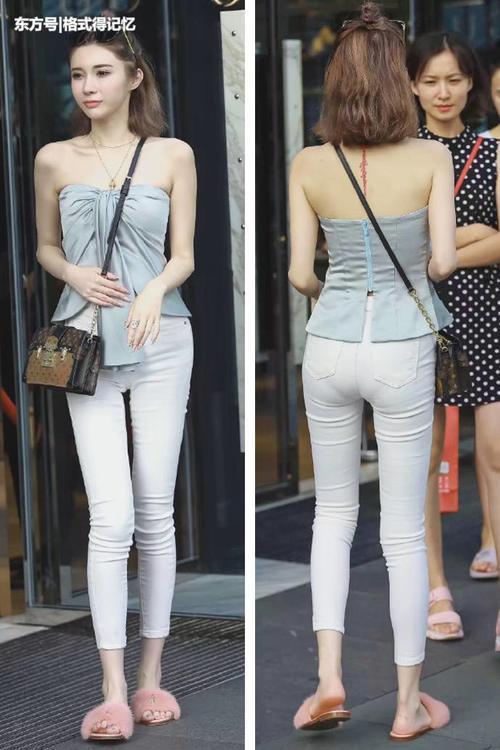 美女穿抹胸装秀娇嫩肌肤，好身材很迷人，背后的大爷有点激动啊！