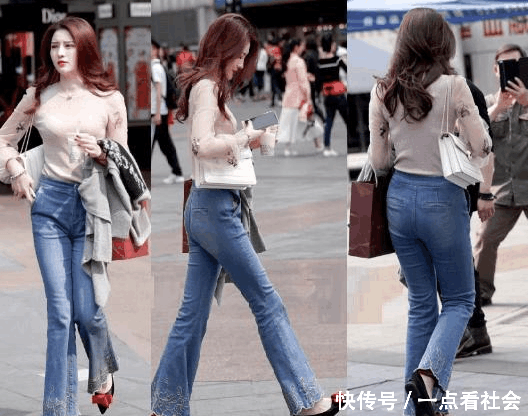 时尚姐姐穿上了牛仔裤，路人大叔要为她照个相，养眼！