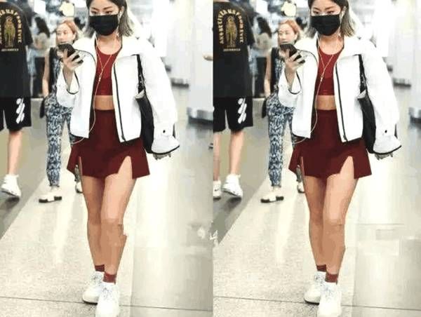 王菊时尚搭配现身机场, “炫腹”秀腿, 看起来像是瘦了二十斤