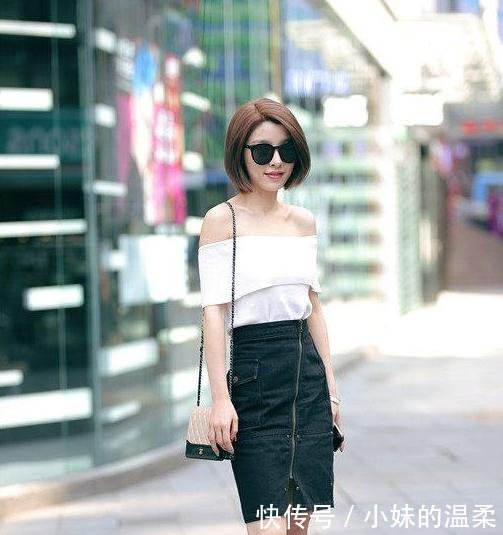 路人街拍，小姐姐身穿刺绣的吊带连衣裙，露出大长腿，充满魅力