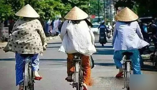 镜头下的越南:男人戴绿帽,美女穿开口到腰的“旗袍”