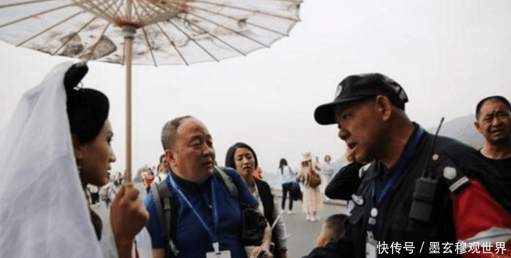 “白娘子”撑伞逛西湖, 没等来许仙, 却被保安驱赶