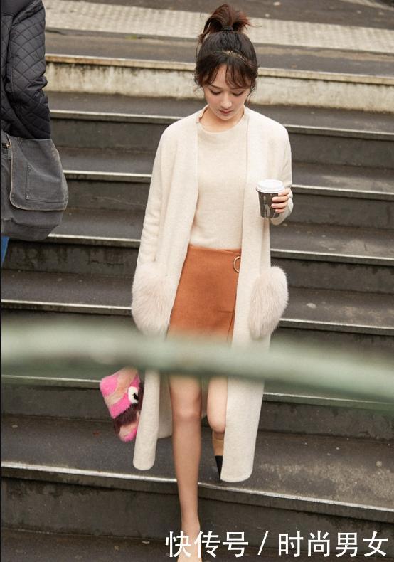 杨紫一身黑现机场，与身旁帅哥亲密耳语，网友：秦俊杰知道吗？