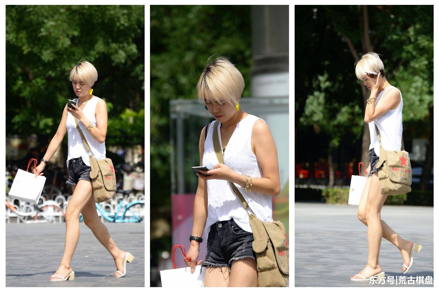 穿着灰色短裤的姑娘在太阳下，有那么一丝骨感的味道