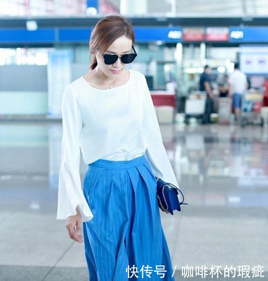 叶一茜现身机场,一条蓝色高腰裤穿得如此显瘦,这才是真正的细腰